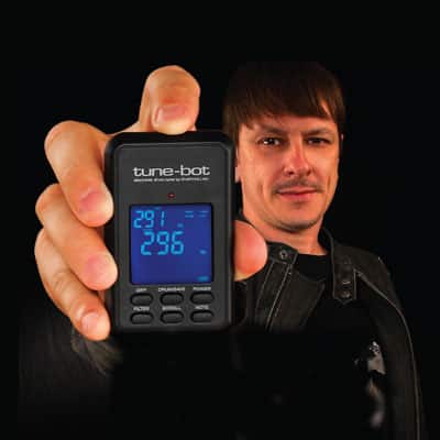 Ray Luzier – Korn holding a tune-bot